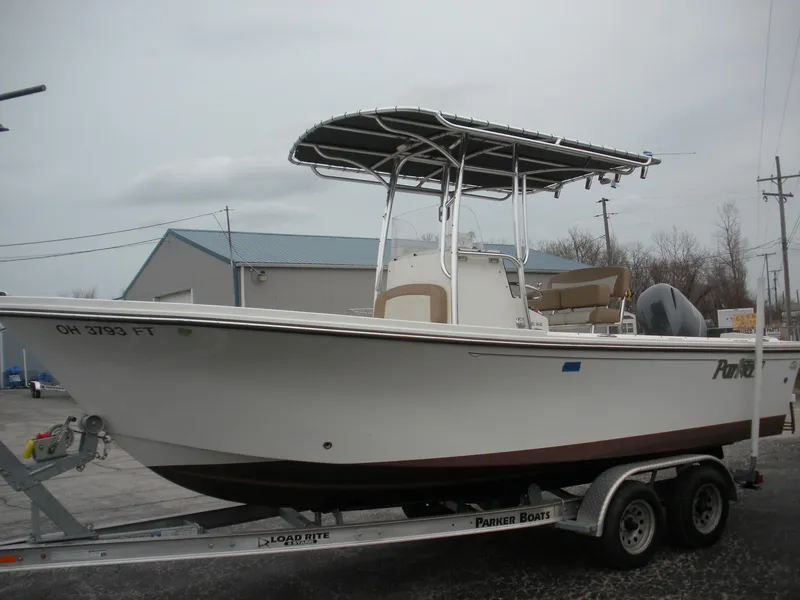 Slide: The Image of 2017 Parker 2100 Special Edition boat on trailer, featuring T-top and outboard motor. - 2