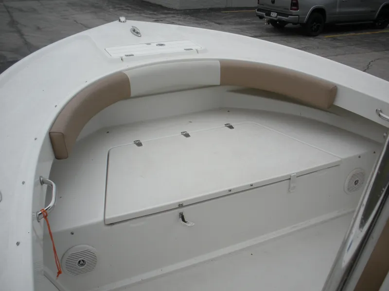 Slide: The Image of 2017 Parker 2100 Special Edition boat interior with cushioned seating and storage compartments. - 3