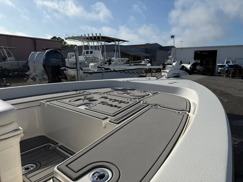 Slide: The Image of 2020 Pathfinder 2200 Tournament boat in a marina with other vessels. - 14