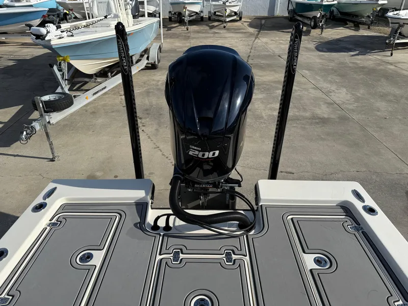 Slide: The Image of 2020 Pathfinder 2200 Tournament boat with powerful outboard motor, docked in a marina. - 3