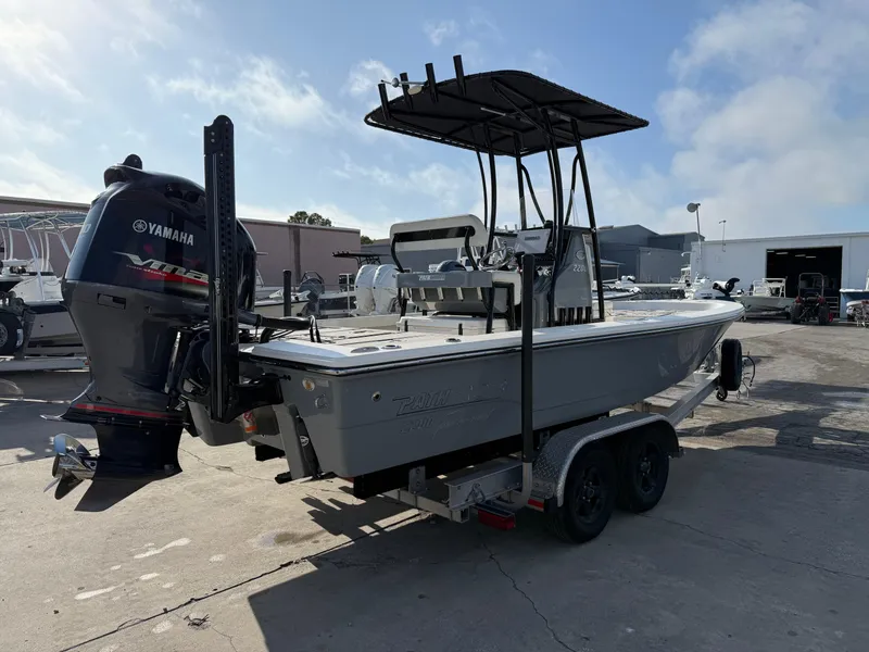 Slide: The Image of 2020 Pathfinder 2200 Tournament boat with Yamaha engine on trailer in a sunny marina. - 9