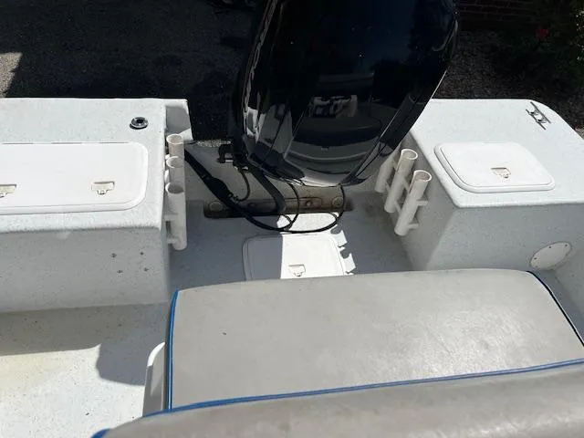 Slide: The Image of 2009 Pro-Line 17 CC boat interior with motor and storage compartments. - 4