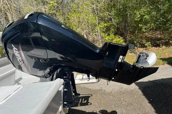 Slide: The Image of 2009 Pro-Line 17 CC boat with Mercury outboard motor in a wooded area. - 8