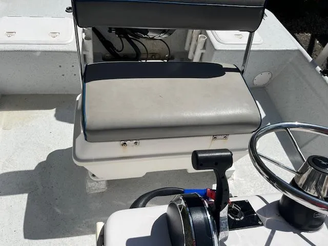 Slide: The Image of 2009 Pro-Line 17 CC boat interior with steering wheel and seating. - 9