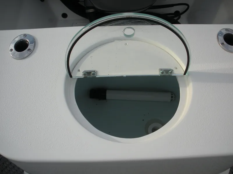 Slide: The Image of Open storage compartment on 2018 Parker 2120 Sport Cabin boat. - 14