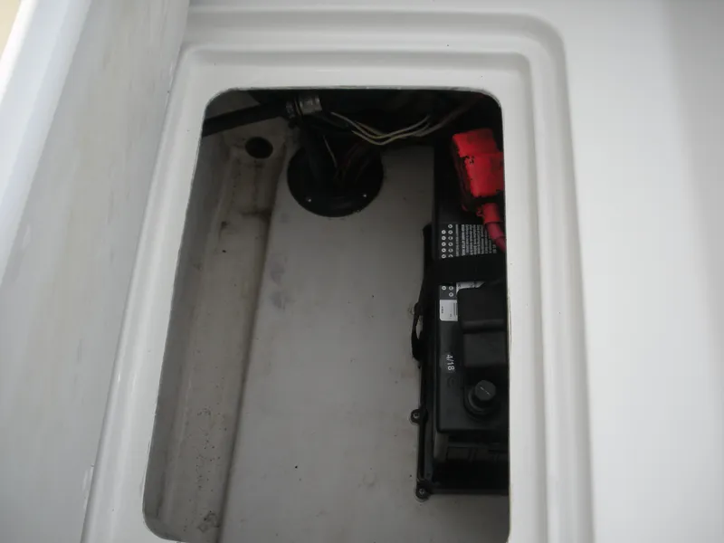 Slide: The Image of Battery compartment of a 2018 Parker 2120 Sport Cabin boat. - 16