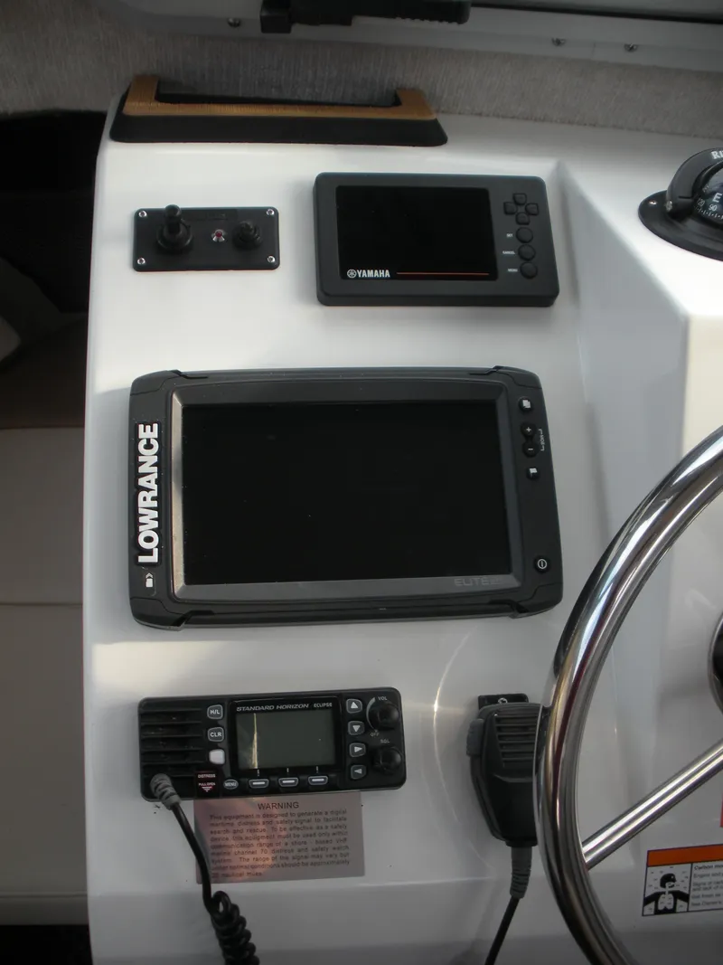 Slide: The Image of Control panel of a 2018 Parker 2120 Sport Cabin with navigation and communication devices. - 6