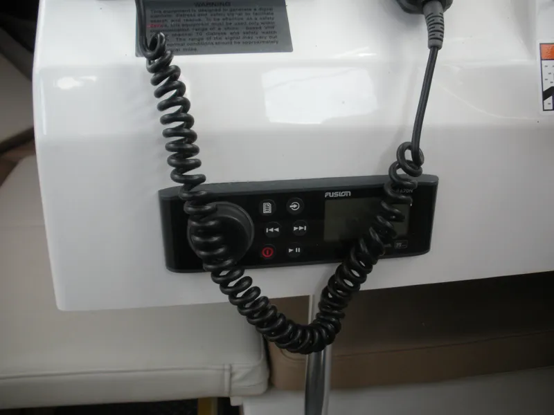 Slide: The Image of Control panel with coiled cable in 2018 Parker 2120 Sport Cabin boat. - 8