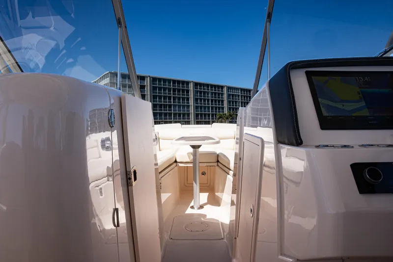 Slide: The Image of 2020 Grady-White Freedom 285 boat interior with modern dashboard and seating. - 16