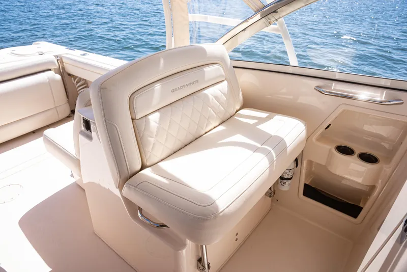 Slide: The Image of 2020 Grady-White Freedom 285 boat interior with luxurious seating and ocean view. - 20