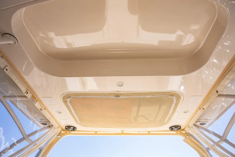 Slide: The Image of 2020 Grady-White Freedom 285 boat interior ceiling with speakers and lighting. - 25