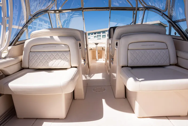 Slide: The Image of 2020 Grady-White Freedom 285 boat interior with luxurious seating and clear canopy. - 30