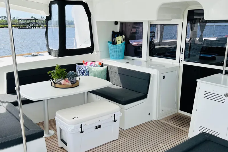 Slide: The Image of Spacious interior of 2019 Lagoon 450 F Owner's Edition catamaran with seating and table. - 16