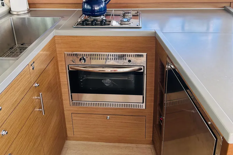 Slide: The Image of Modern kitchen in 2019 Lagoon 450 F yacht with stove, oven, and sink. - 24