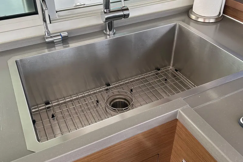 Slide: The Image of Stainless steel sink in Lagoon 450 F Owner's Edition yacht kitchen, 2019 model. - 26