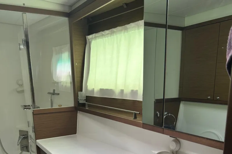 Slide: The Image of Luxurious bathroom in 2019 Lagoon 450 F Owner's Edition yacht, featuring modern fixtures and elegant design. - 33