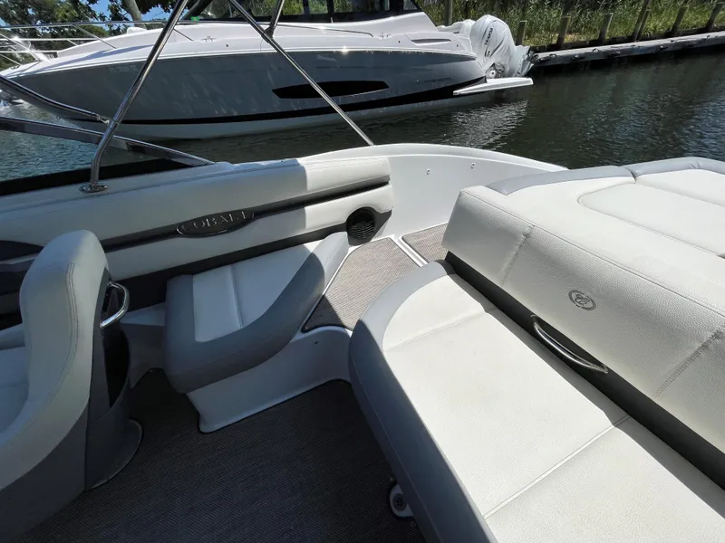 Slide: The Image of Interior of a 2018 Cobalt CS22 boat with white seating and sleek design. - 6