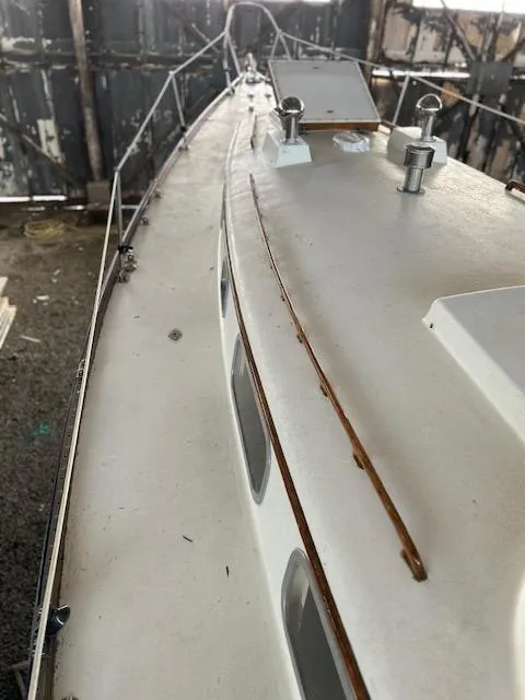 Slide: The Image of 1972 Bristol 40 sailboat deck view in a rustic setting. - 12
