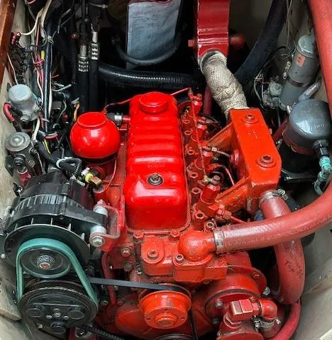 Slide: The Image of 1972 Bristol 40 engine, vibrant red, detailed components, vintage mechanical design. - 44