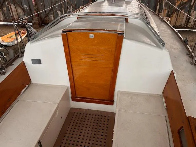 Slide: The Image of 1972 Bristol 40 sailboat cockpit with wooden hatch and seating. - 7