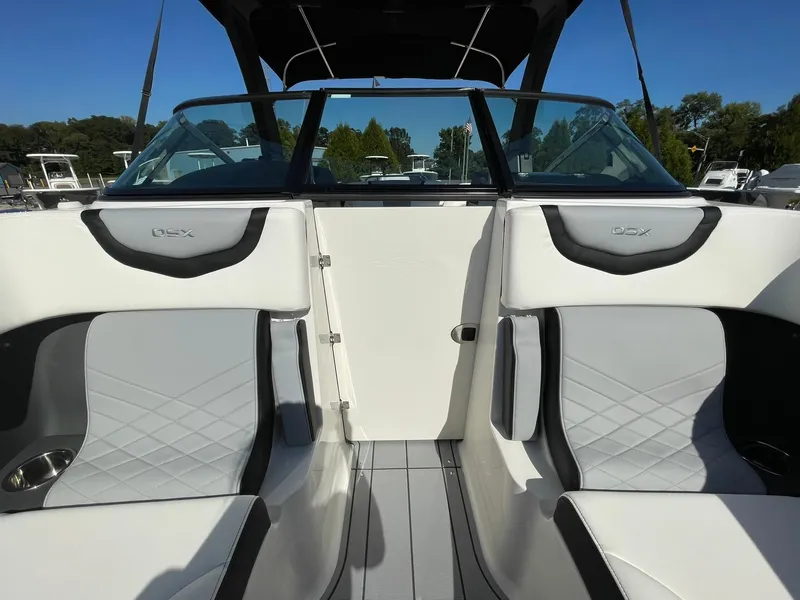 Slide: The Image of 2025 Chaparral 270 OSX boat interior with sleek seating and modern design. - 22