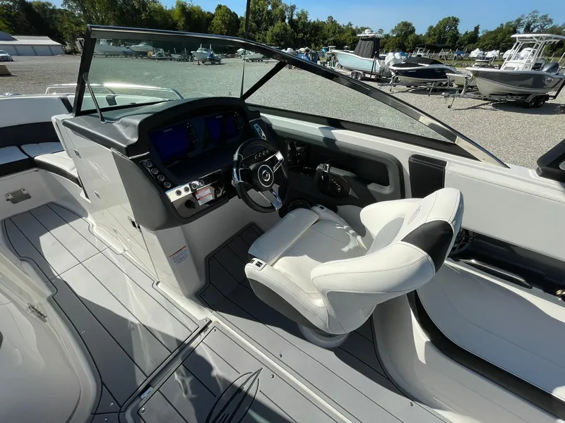 Slide: The Image of 2025 Chaparral 270 OSX boat cockpit with modern steering and controls. - 30