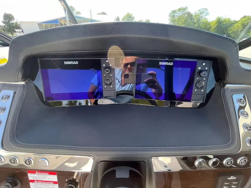 Slide: The Image of Dashboard of 2025 Chaparral 270 OSX boat with dual Simrad displays. - 32