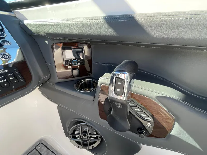 Slide: The Image of Control panel of 2025 Chaparral 270 OSX boat with joystick and speaker. - 33
