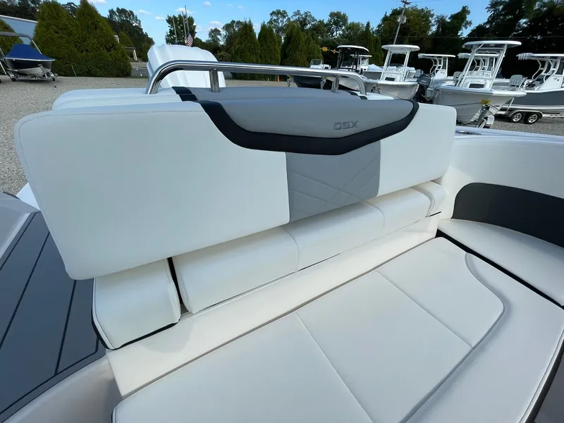 Slide: The Image of 2025 Chaparral 270 OSX boat interior with white seating and sleek design. - 43