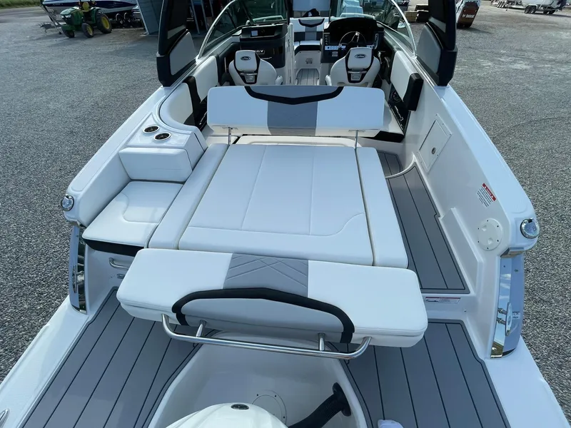 Slide: The Image of 2025 Chaparral 270 OSX boat interior with seating and deck view. - 44