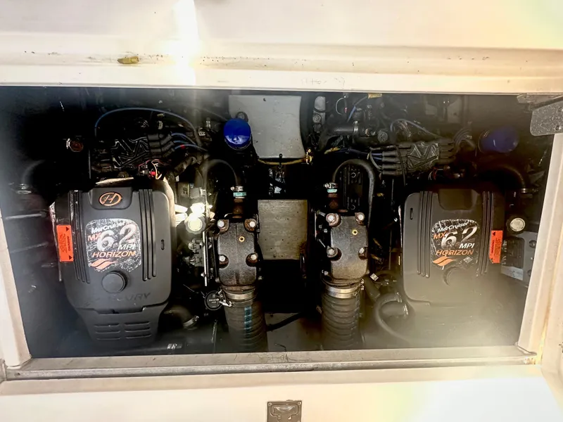 Slide: The Image of 2003 Cruisers Yachts 3372 Express engine compartment with twin 6.2 Horizon engines. - 10