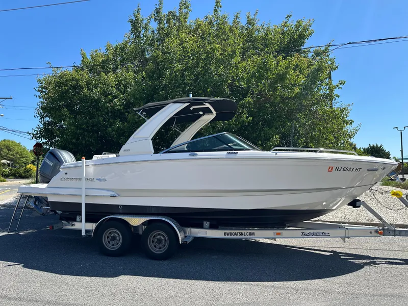 Slide: The Image of 2023 Chaparral 270 OSX boat on trailer, parked outdoors. - 3
