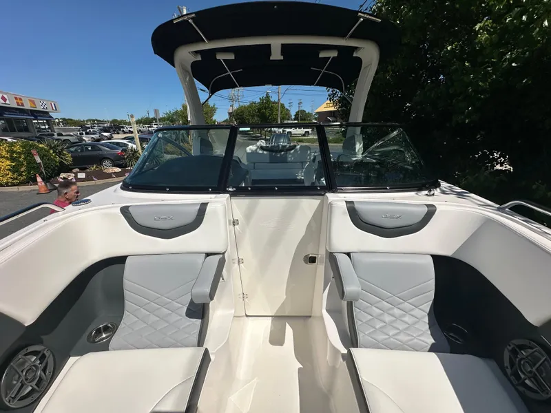 Slide: The Image of 2023 Chaparral 270 OSX boat interior with luxurious seating and modern design. - 37