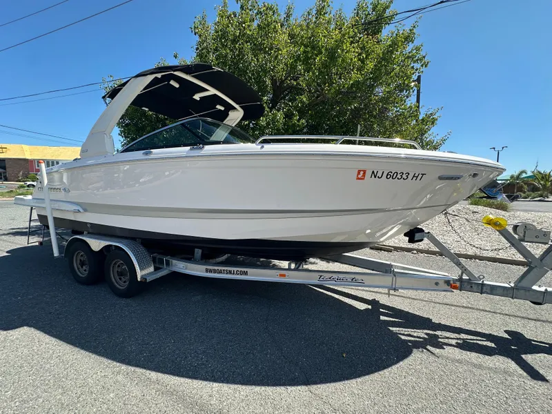 Slide: The Image of 2023 Chaparral 270 OSX boat on trailer, parked outdoors. - 4