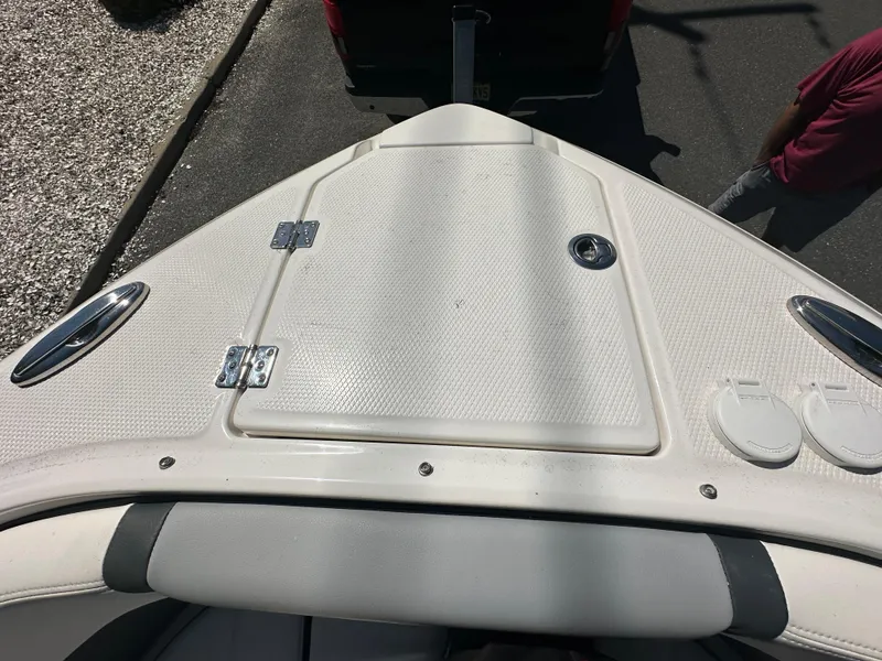 Slide: The Image of 2023 Chaparral 270 OSX boat bow with storage hatch and sleek design. - 43