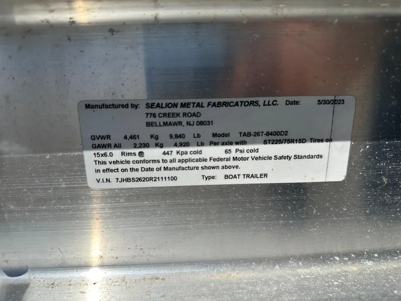 Slide: The Image of Label on boat trailer by Sealion Metal Fabricators, LLC, detailing specifications and compliance. - 46