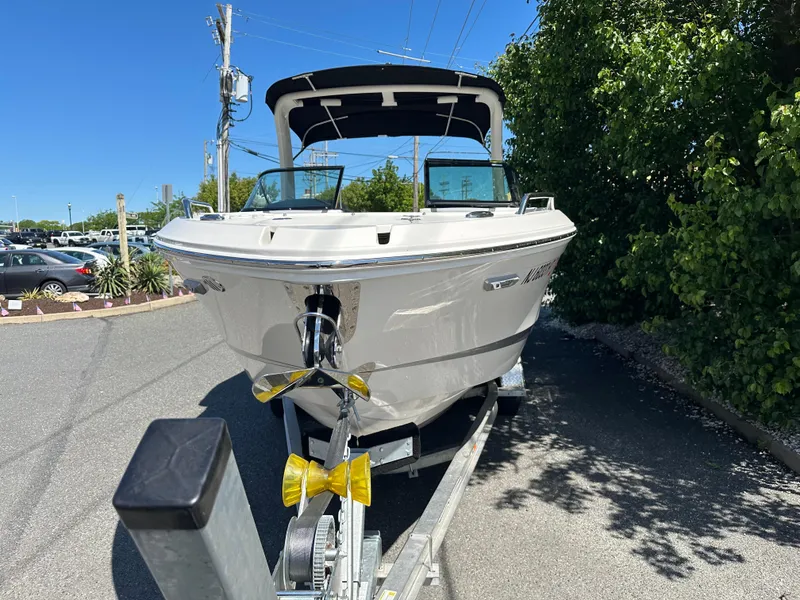 Slide: The Image of 2023 Chaparral 270 OSX boat on trailer, parked outdoors, sunny day. - 8