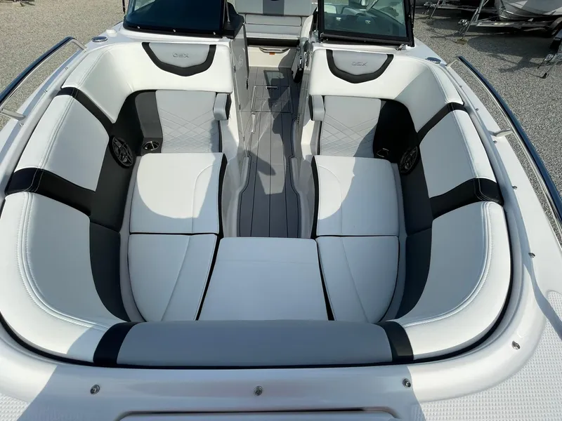 Slide: The Image of 2025 Chaparral 270 OSX boat interior with white and black seating. - 11