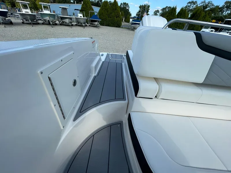 Slide: The Image of 2025 Chaparral 270 OSX boat interior with sleek seating and modern design. - 42