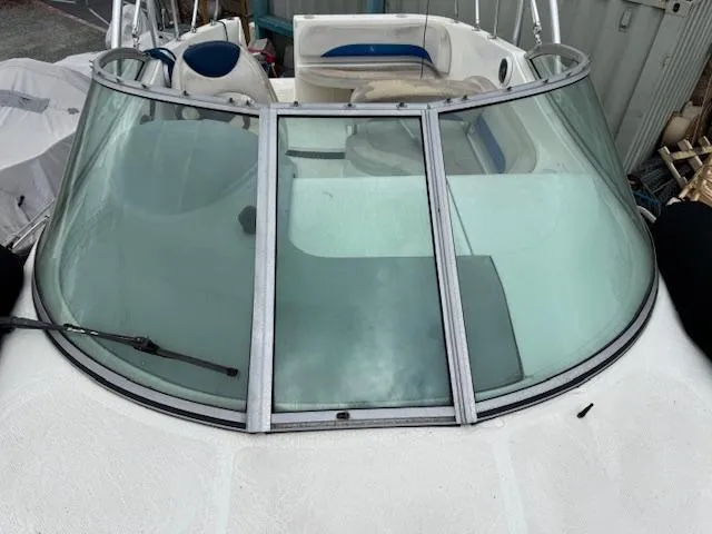 Slide: The Image of 2006 Bayliner 265 SD boat windshield and cockpit view. - 10