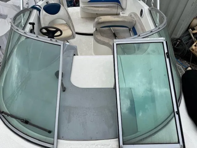 Slide: The Image of 2006 Bayliner 265 SD boat interior with seating and steering wheel. - 11