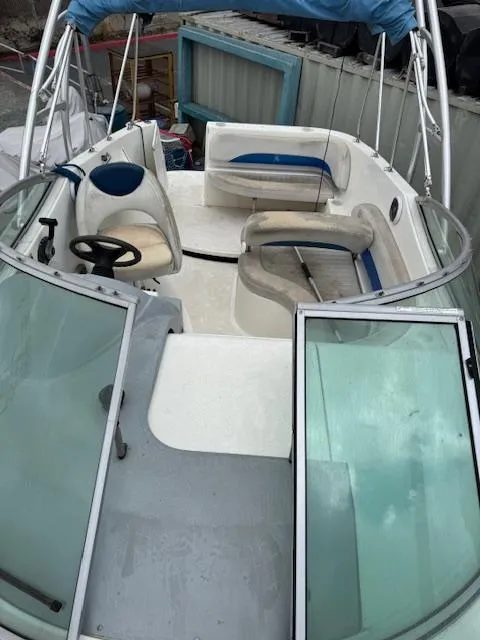 Slide: The Image of 2006 Bayliner 265 SD boat interior with seating and steering wheel. - 12