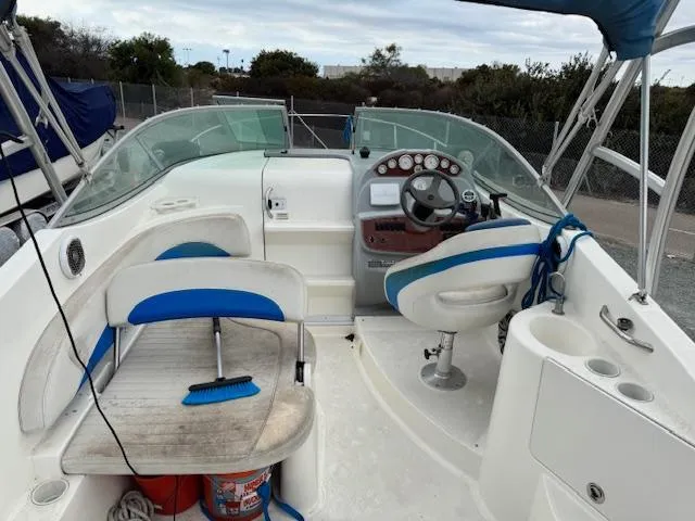 Slide: The Image of 2006 Bayliner 265 SD boat interior with steering wheel and seating. - 8