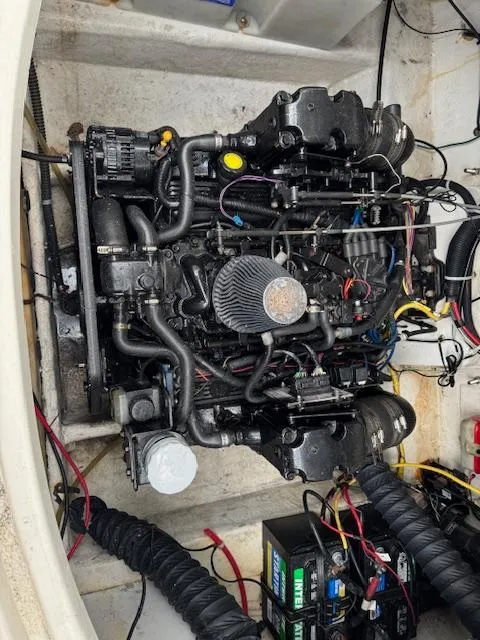 Slide: The Image of Engine compartment of a 2006 Bayliner 265 SD boat, showcasing intricate mechanical components. - 3