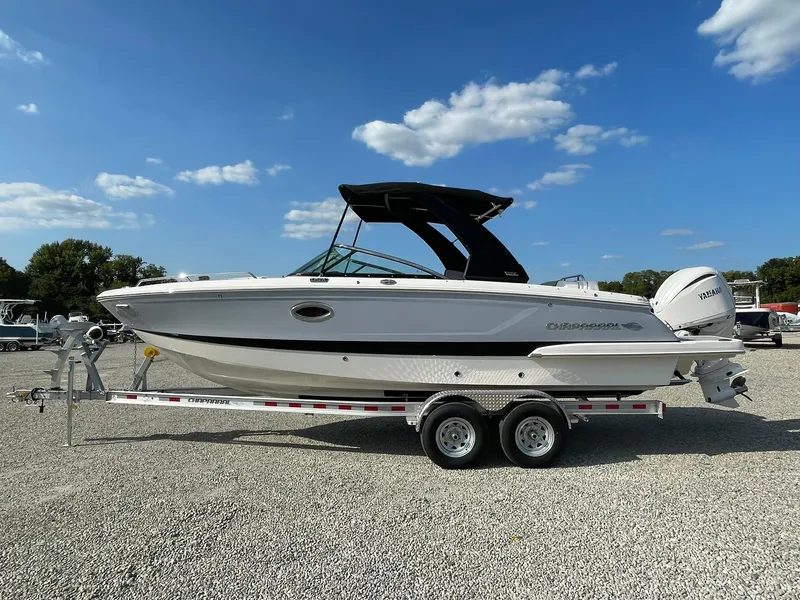 The Image of 2025 Chaparral 270 OSX boat on trailer under blue sky. - 0