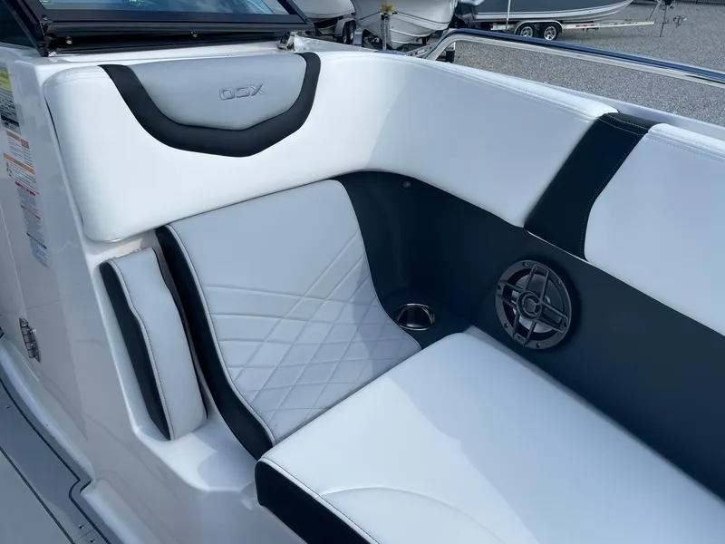 Slide: The Image of Luxurious seating in the 2025 Chaparral 270 OSX boat with sleek design and speaker. - 14
