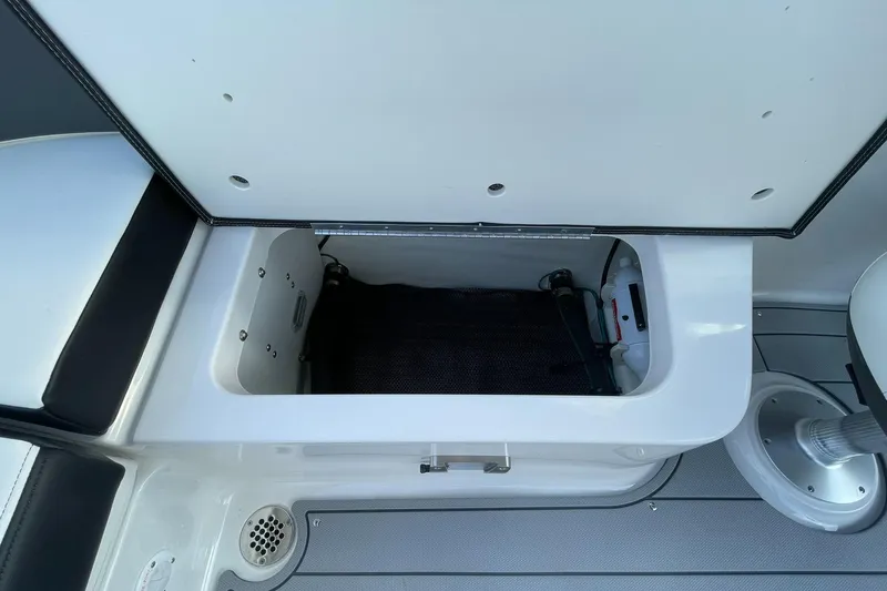 Slide: The Image of Open storage compartment on 2025 Chaparral 270 OSX boat deck. - 37