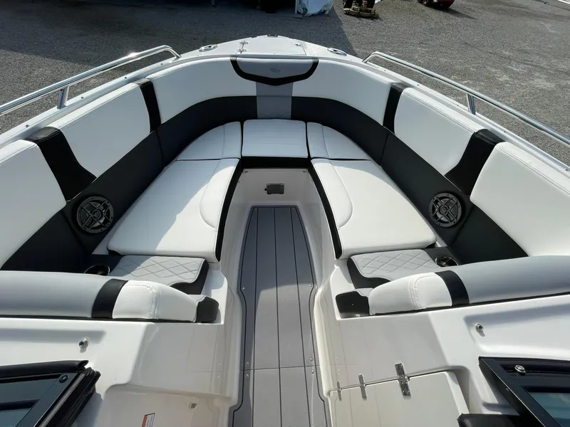 Slide: The Image of 2025 Chaparral 270 OSX boat interior with sleek seating and modern design. - 8
