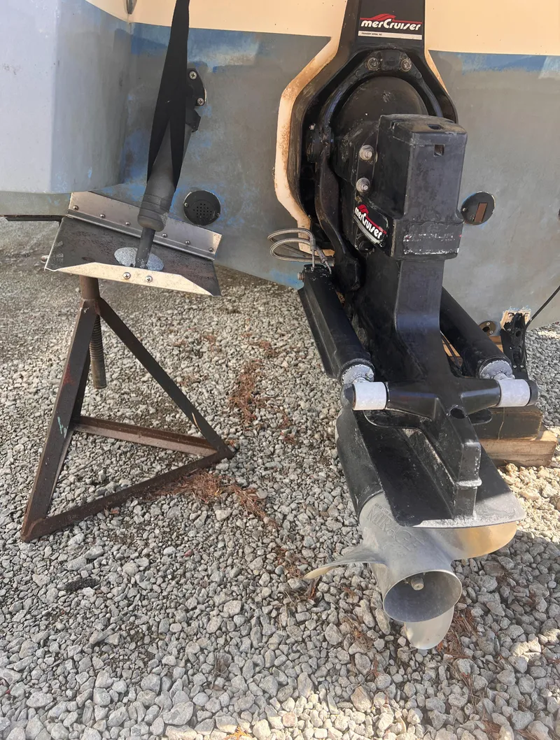 Slide: The Image of 1998 Chaparral 270 Signature boat with MerCruiser outdrive on gravel. - 16