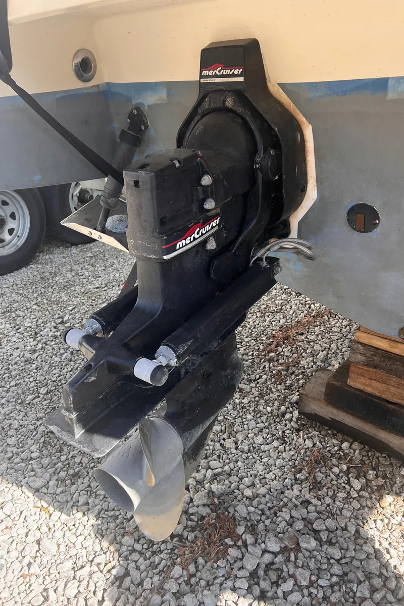 Slide: The Image of 1998 Chaparral 270 Signature boat with MerCruiser outdrive on gravel surface. - 18